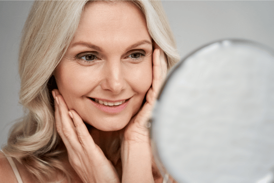 adapalane vs tretinoin - image of woman looking at skin