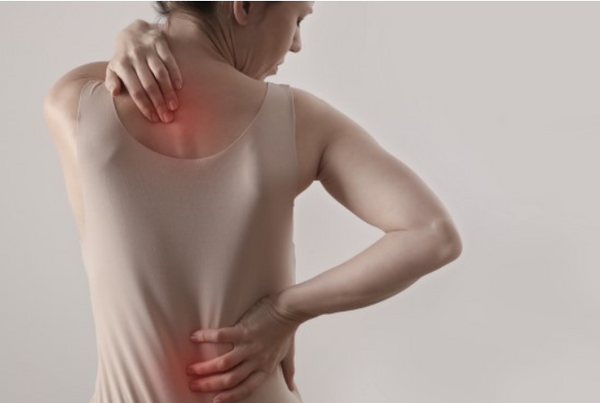 woman feeling back pain