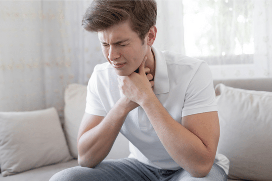 Man with postnasal drip, irritating