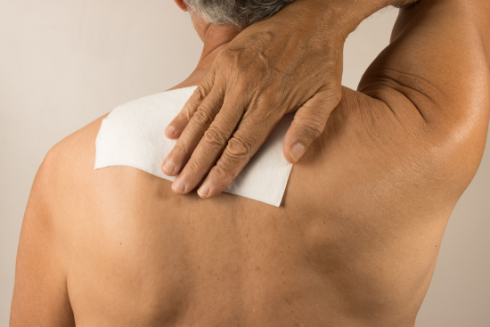 Lidocaine patch on upper back